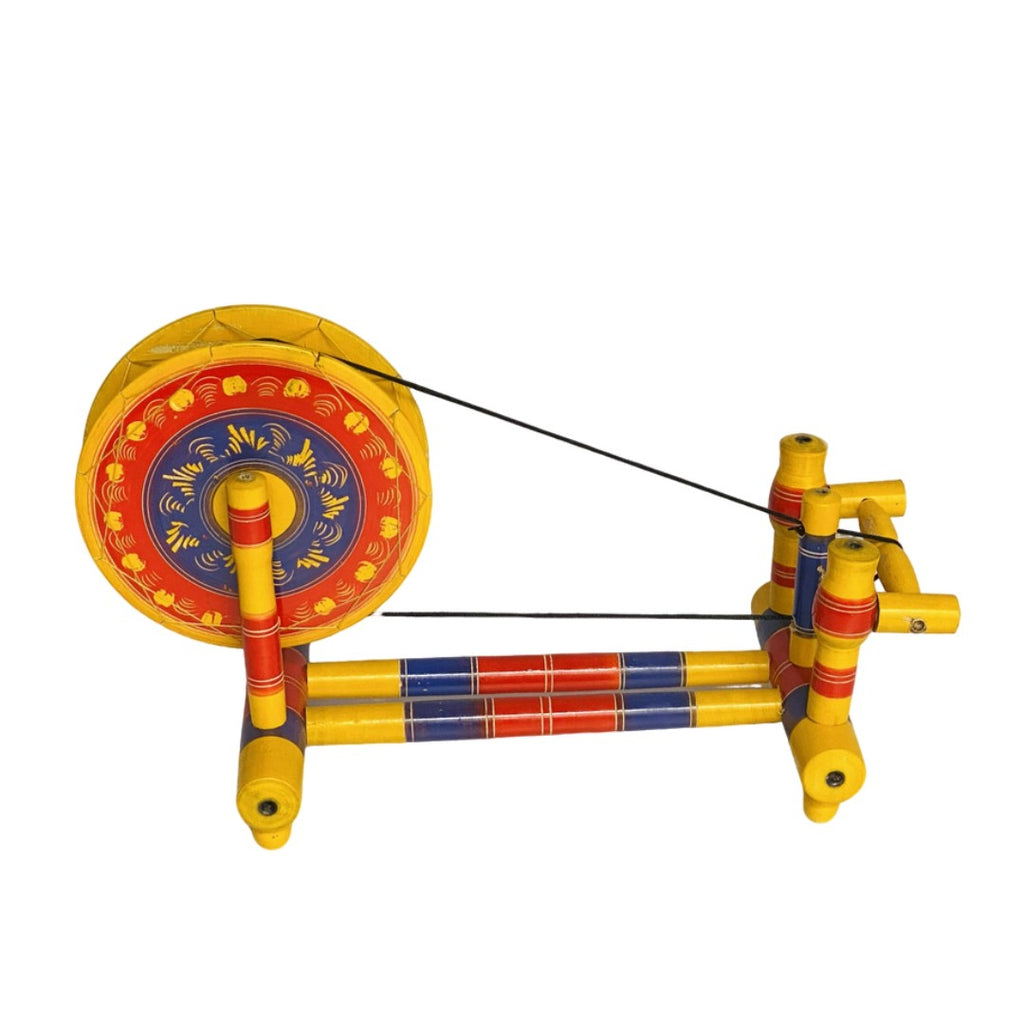 Traditional wooden Charkha – handcrafted decorative piece for cultural home decor.