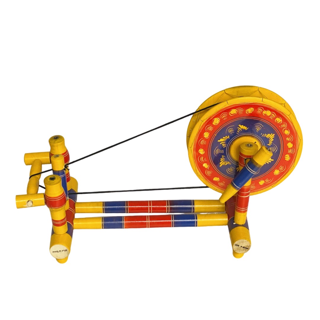 Traditional wooden Charkha – handcrafted decorative piece for cultural home decor.