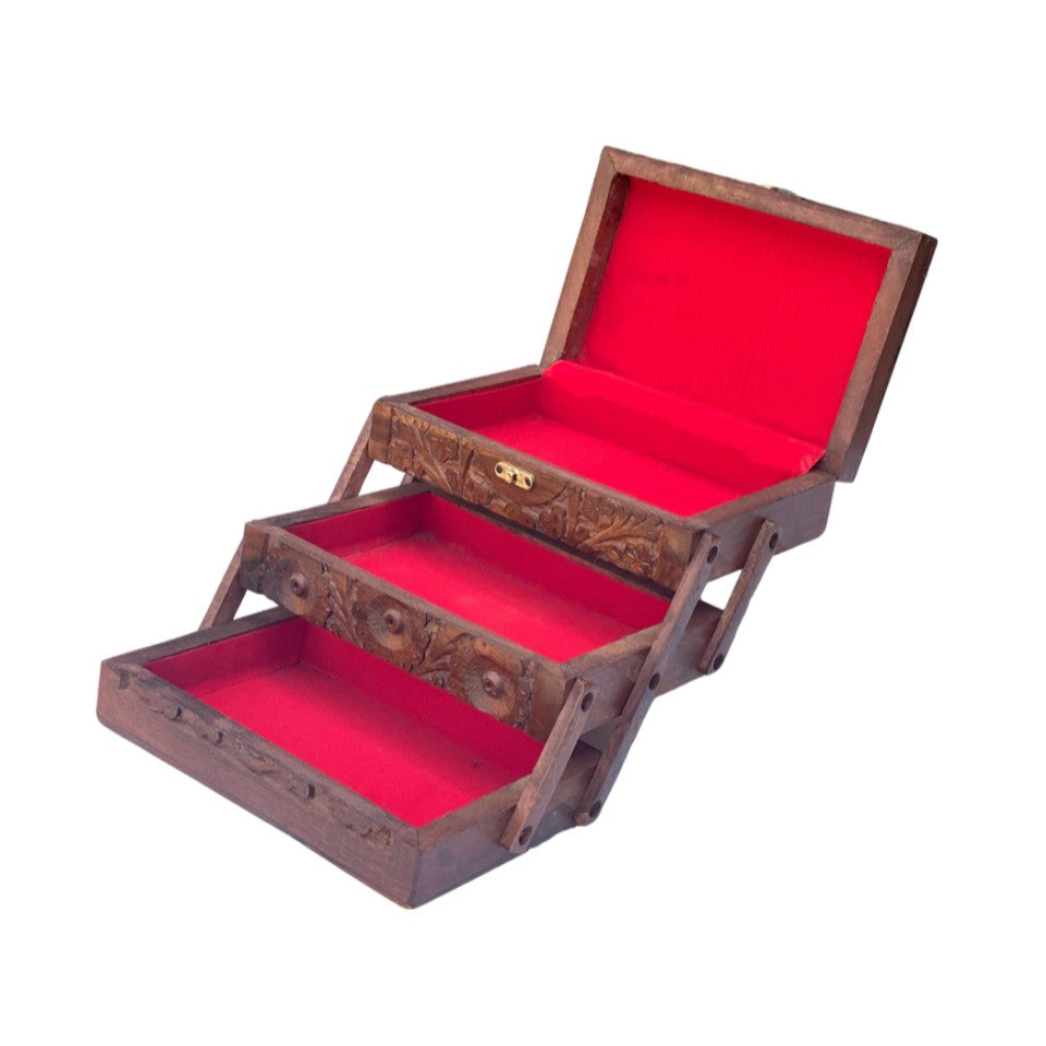 Handcrafted wooden 3-tier jewelry box with intricate floral carvings and red velvet interior, featuring multiple compartments and brass latch.
