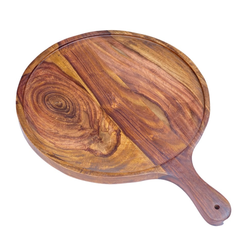 Set of three handcrafted wooden serving platters with natural acacia wood grain patterns and handles, arranged in a nested display