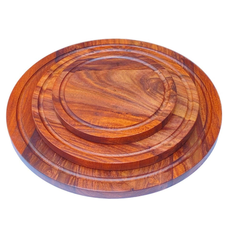 Set of three handcrafted round wooden platters made from premium acacia wood, featuring natural grain patterns and raised edges, perfect for serving pizza, charcuterie, and entertaining