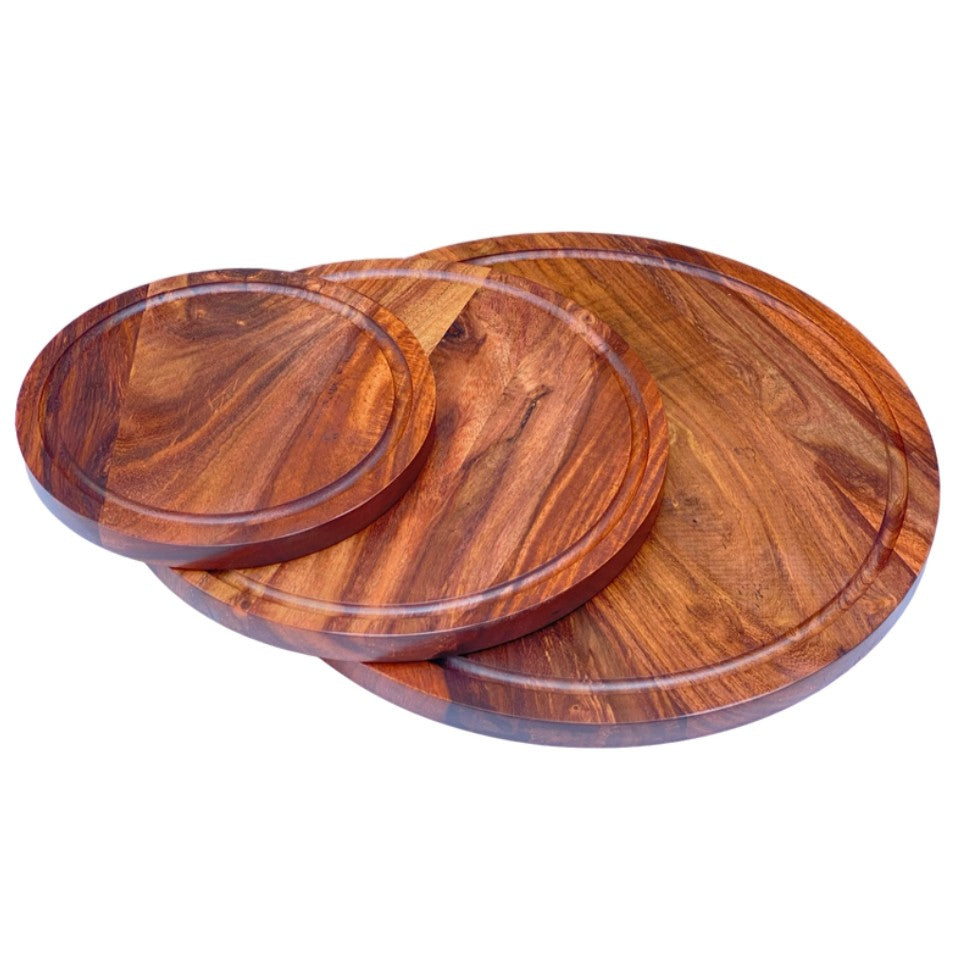 Set of three handcrafted round wooden platters made from premium acacia wood, featuring natural grain patterns and raised edges, perfect for serving pizza, charcuterie, and entertaining