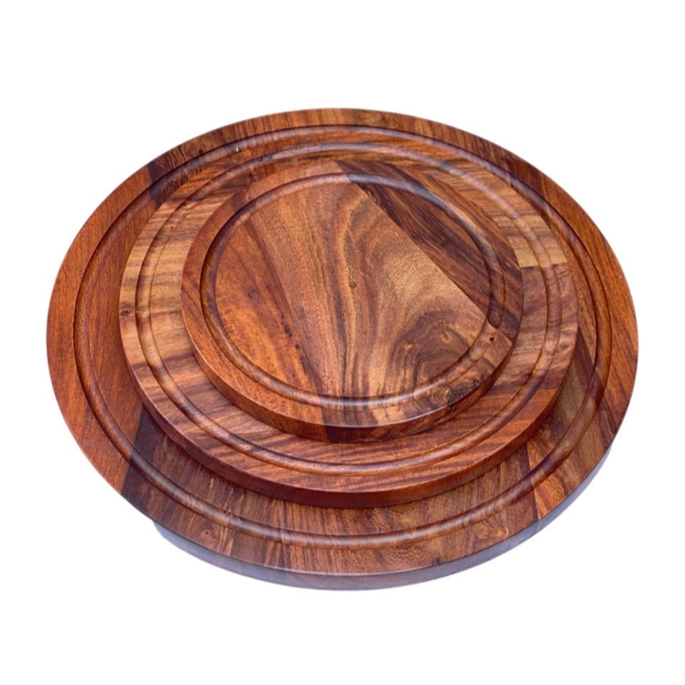 Set of three handcrafted round wooden platters made from premium acacia wood, featuring natural grain patterns and raised edges, perfect for serving pizza, charcuterie, and entertaining
