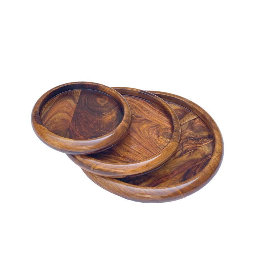 Handcrafted round wooden plate set with polished finish – nesting design.