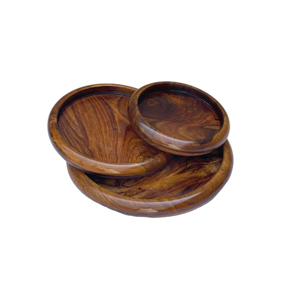 Handcrafted round wooden plate set with polished finish – nesting design.