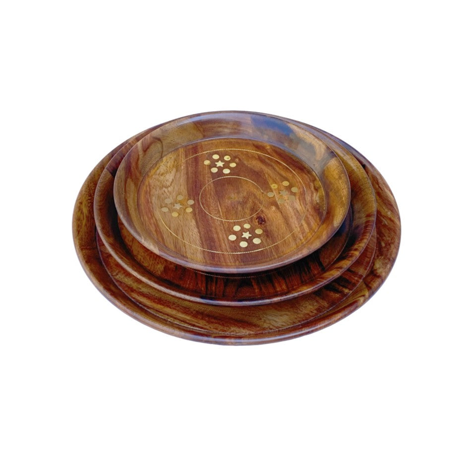 Handcrafted round wooden plate set with elegant brass inlay design – perfect for serving and home decor.