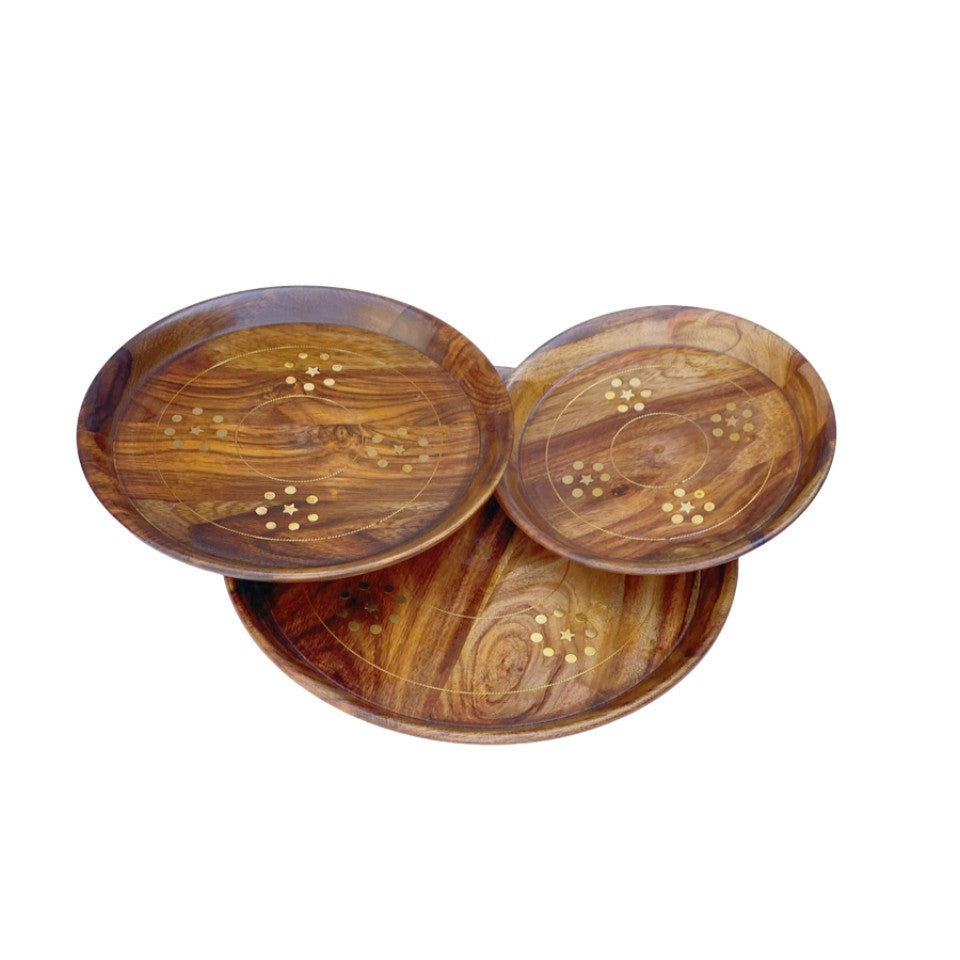 Handcrafted round wooden plate set with elegant brass inlay design – perfect for serving and home decor.