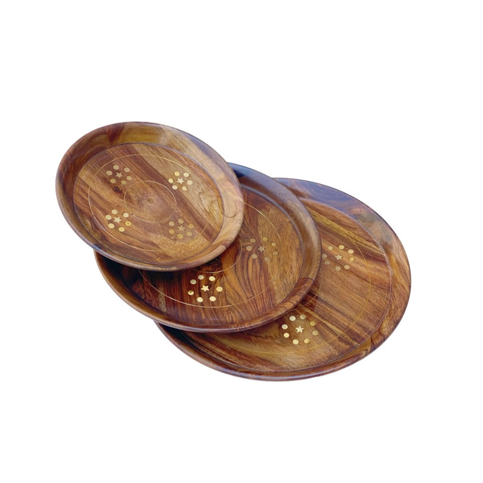 Handcrafted round wooden plate set with elegant brass inlay design – perfect for serving and home decor.