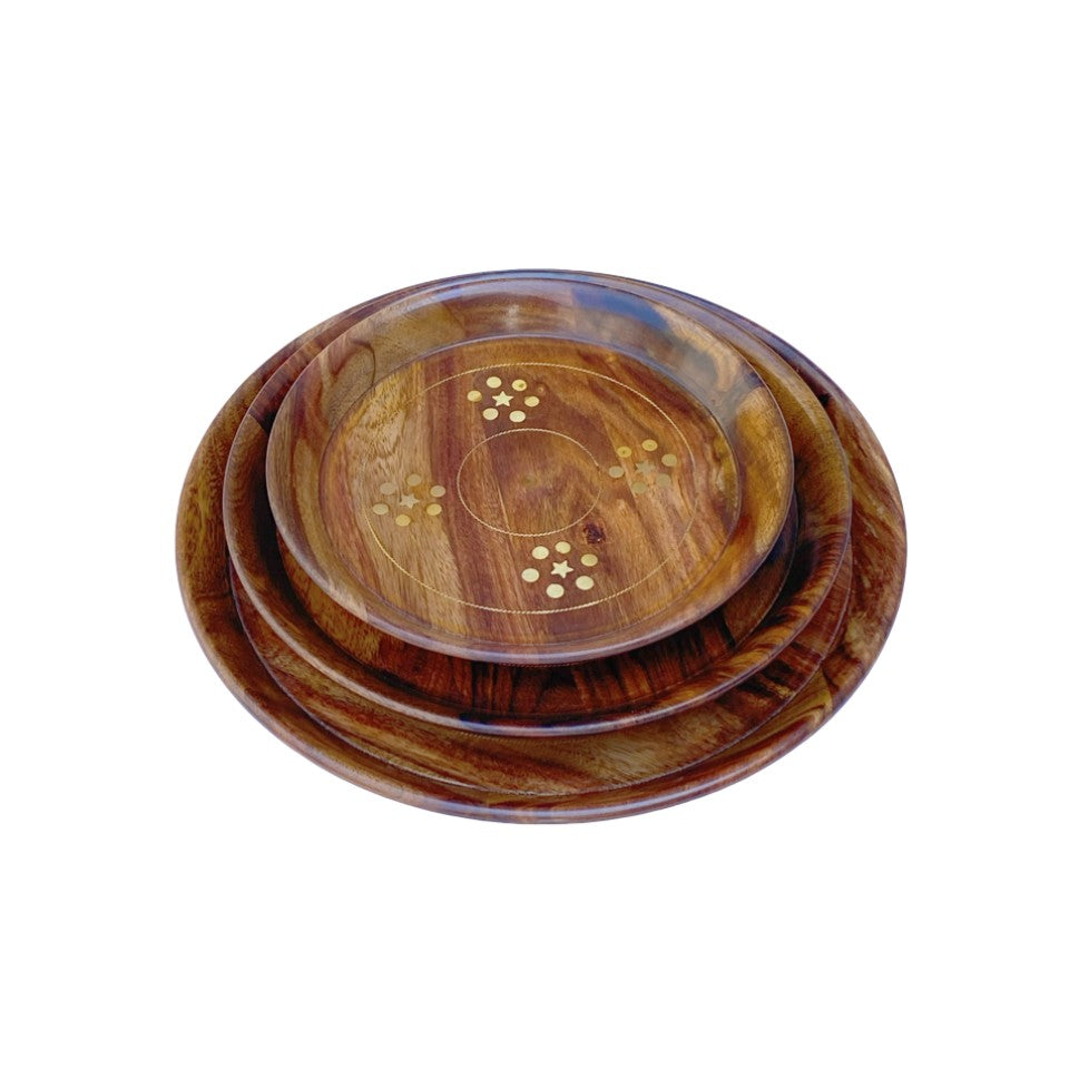 Handcrafted round wooden plate set with elegant brass inlay design – perfect for serving and home decor.