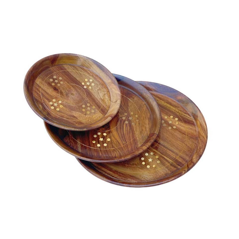 Handcrafted round wooden plate set with elegant brass inlay design – perfect for serving and home decor.