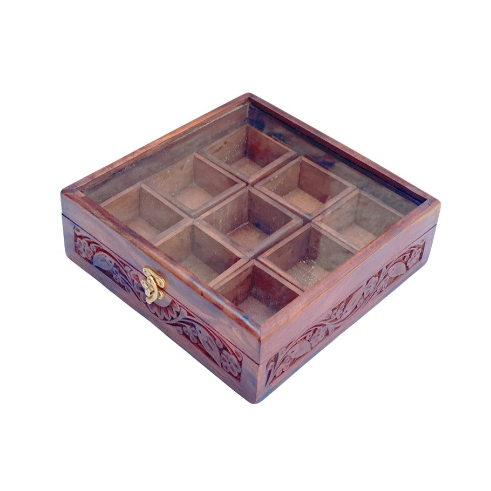  Handcrafted wooden spice box with 9 compartments, glass lid and decorative floral carving, perfect for organizing kitchen spices and herbs.