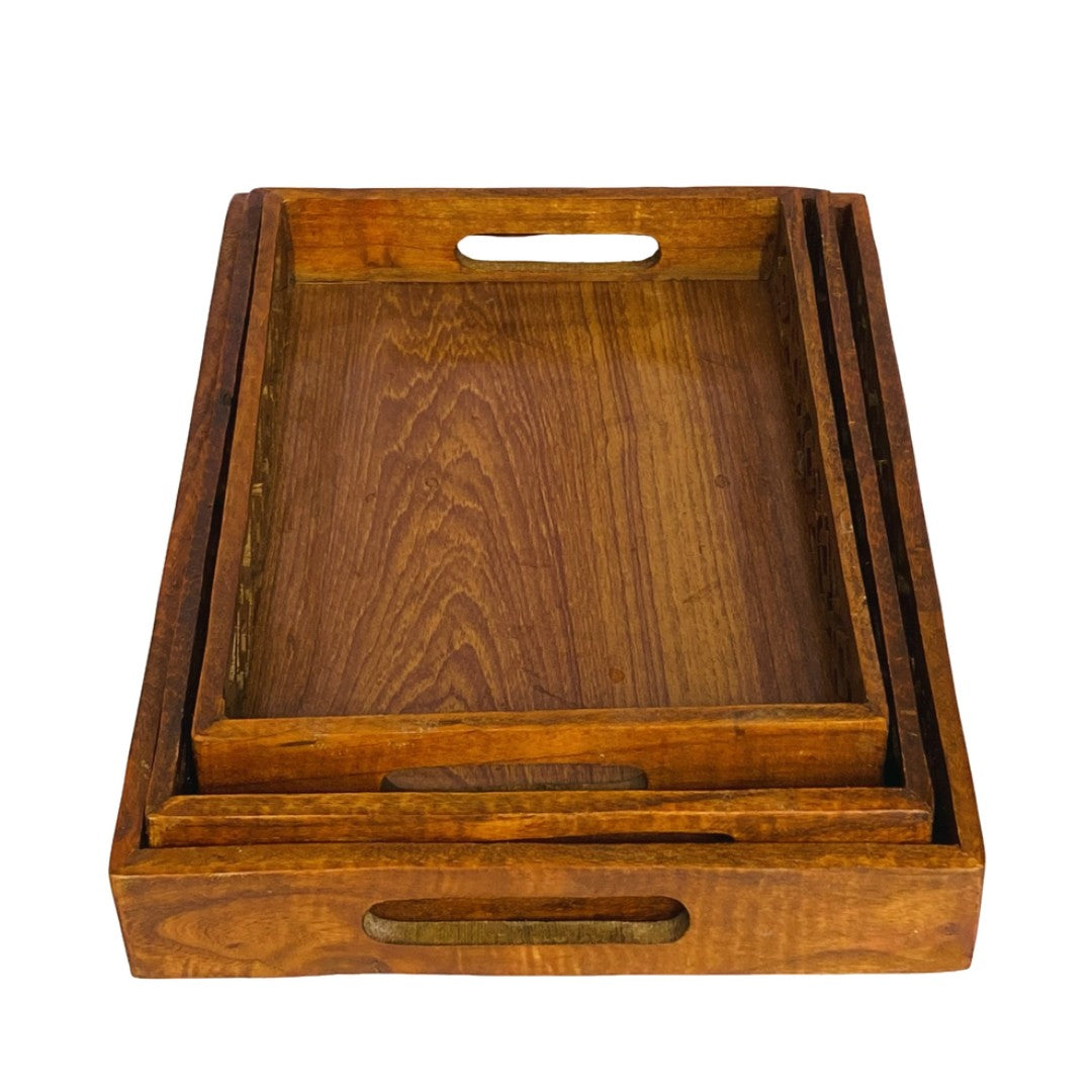 Wooden tray set with intricate cutwork – elegant handcrafted serving trays.