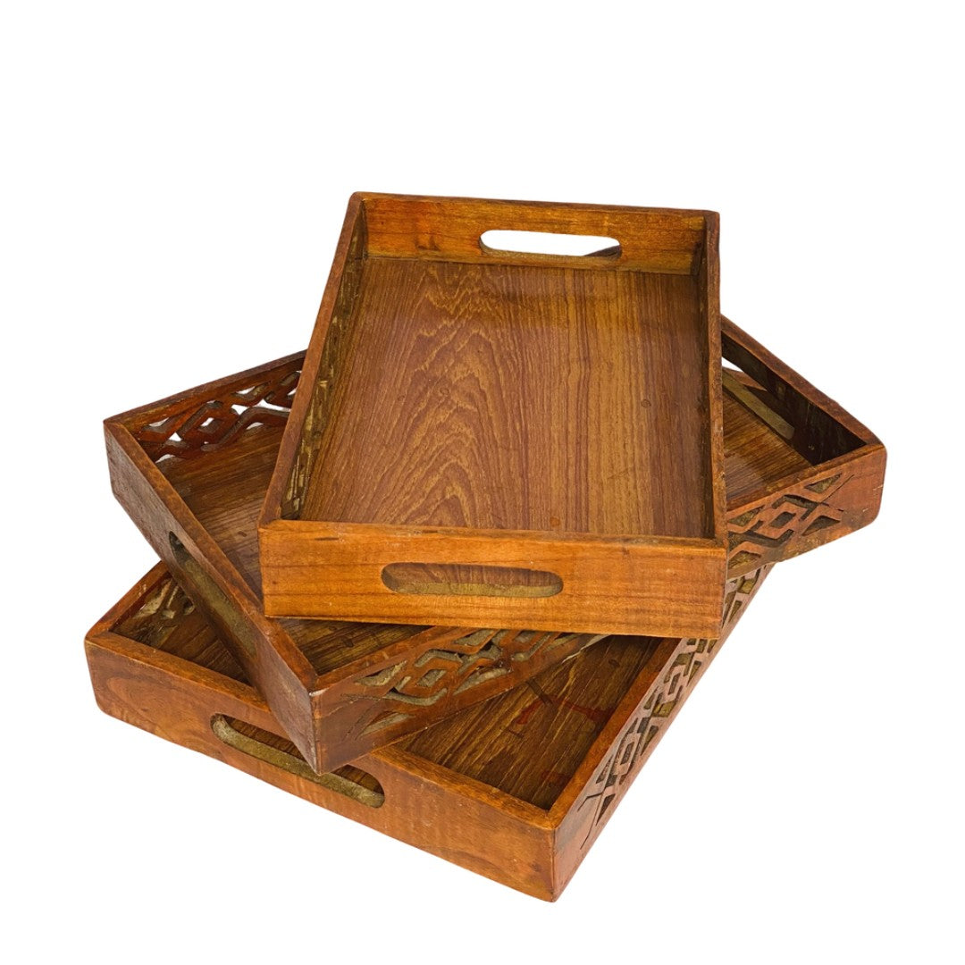 Wooden tray set with intricate cutwork – elegant handcrafted serving trays.