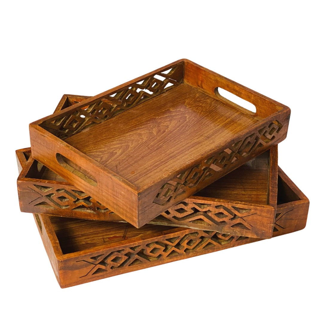 Wooden tray set with intricate cutwork – elegant handcrafted serving trays.