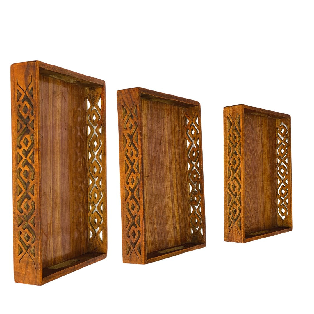 Wooden tray set with intricate cutwork – elegant handcrafted serving trays.