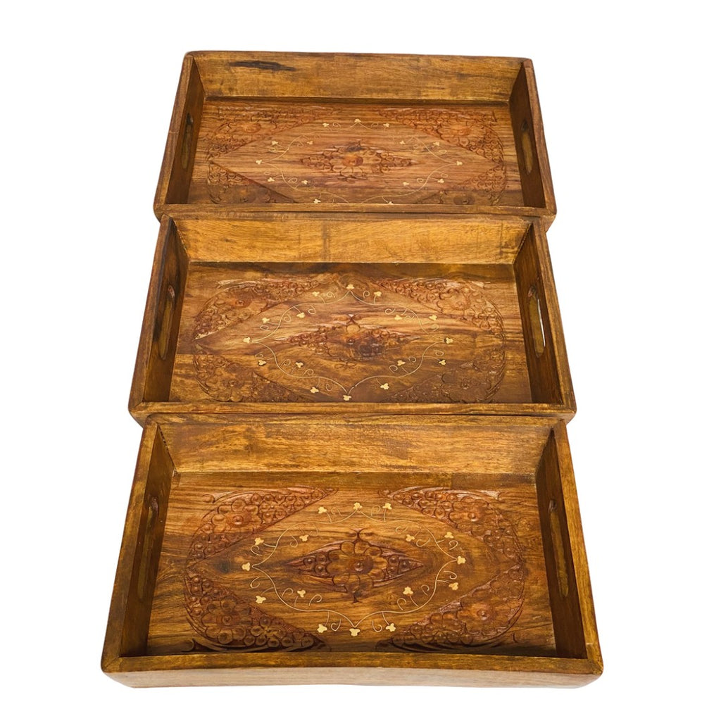 Handcrafted tray set with brass and carving design – elegant decorative serving trays.