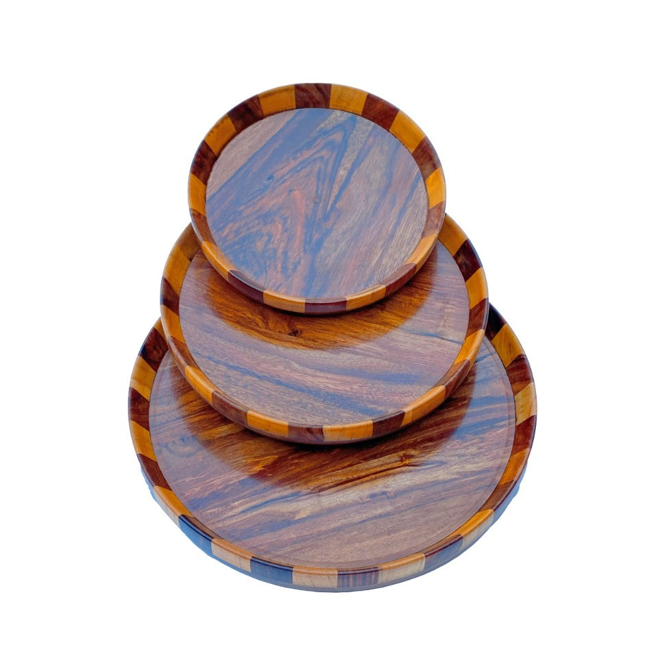  Handcrafted wooden plate set with multi-wood mosaic design featuring three nested plates in varying sizes made from walnut, cherry, and maple woods.
