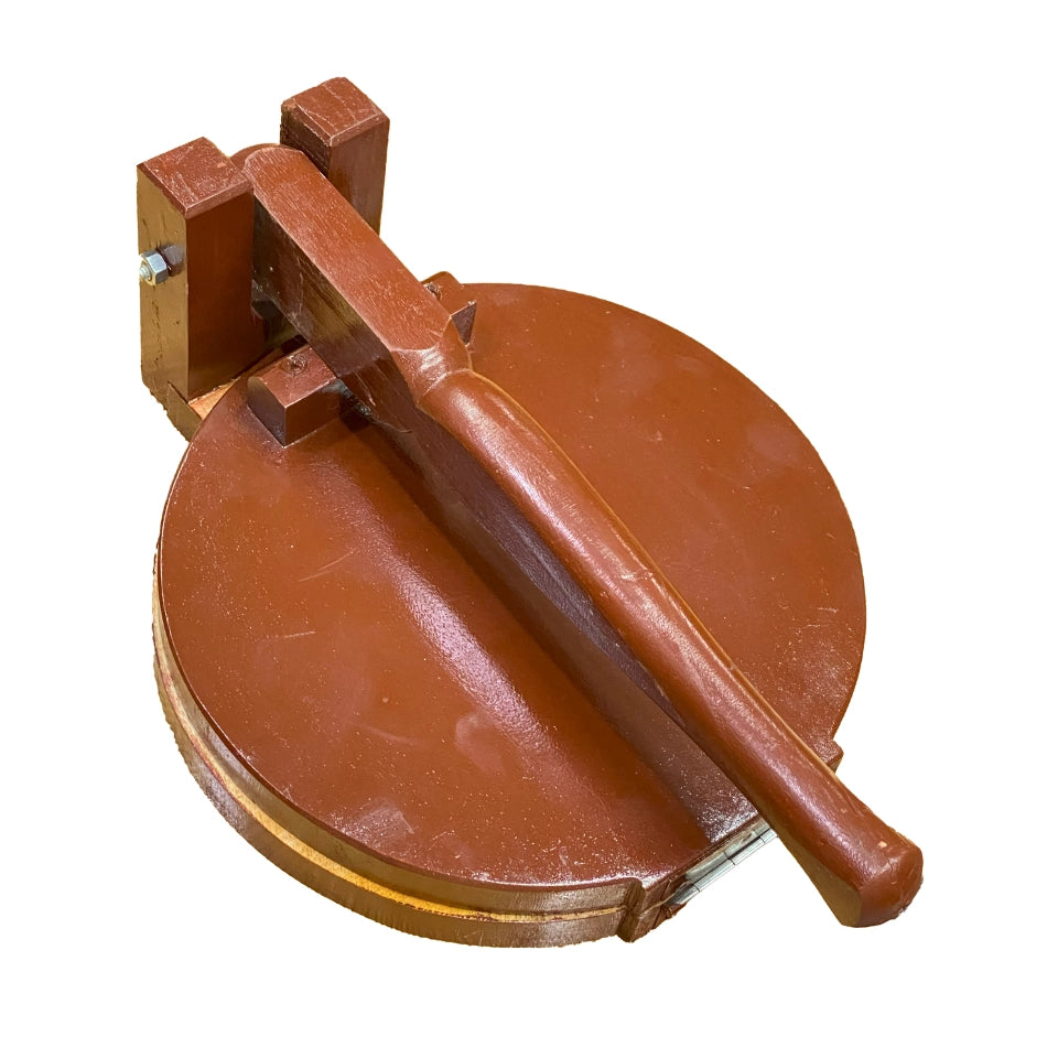 Traditional wooden roti maker with circular press plate and lever handle, handcrafted from rich brown wood for making fresh flatbreads