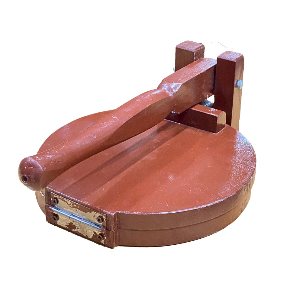 Traditional wooden roti maker with circular press plate and lever handle, handcrafted from rich brown wood for making fresh flatbreads