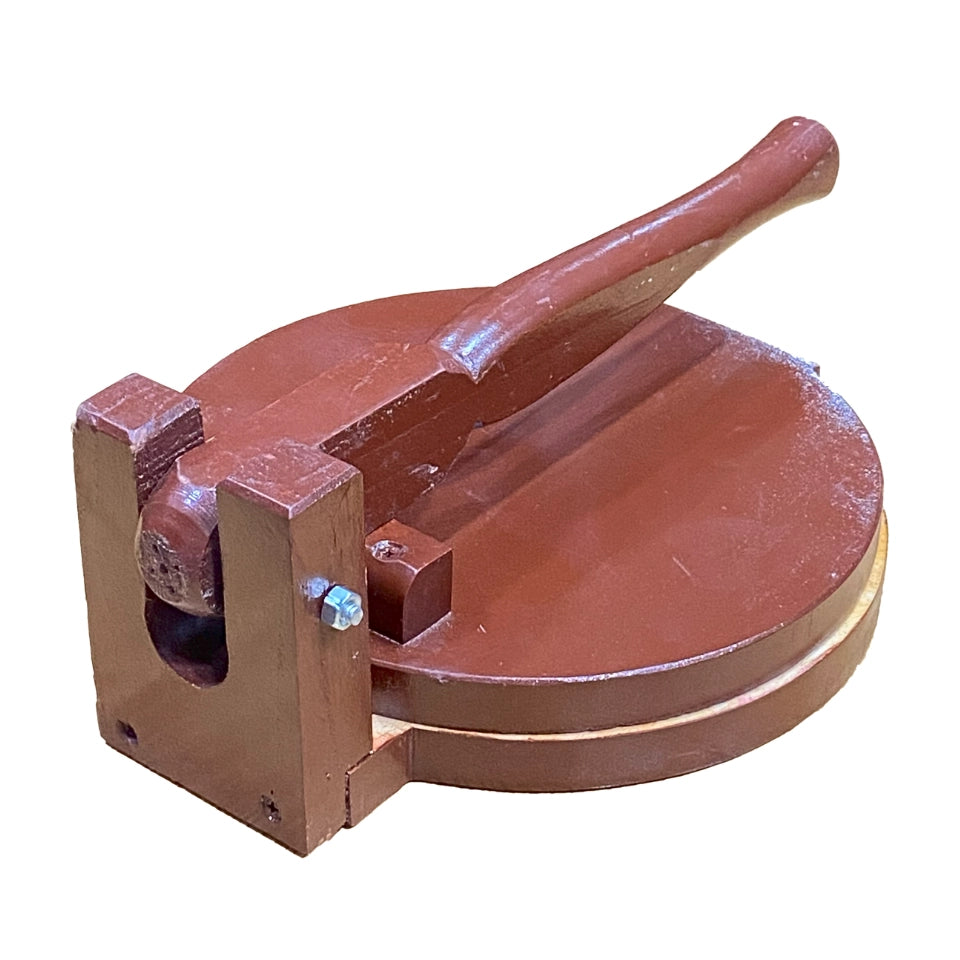 Traditional wooden roti maker with circular press plate and lever handle, handcrafted from rich brown wood for making fresh flatbreads